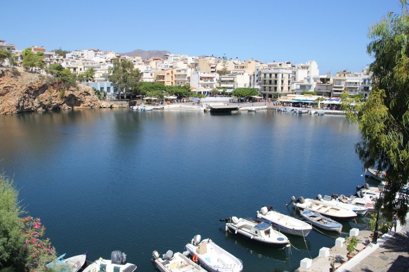 IMG_9160.JPG - The town radiates out from a small inland lagoon, Lake Voulismeni (sunken lake), which since 1870 has been connected by a narrow channel to the old town harbor.  Agios Nikolaos, a gem of a town nestling beside the Gulf of Mirabello on Crete’s north-east coast. 