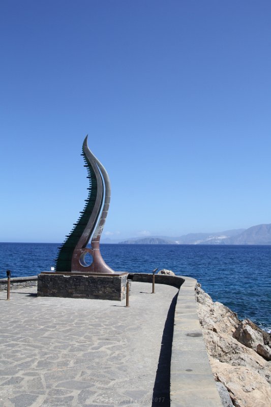 IMG_9252.JPG - Horn of Amalthea, sulpture of Glass and copper. It represents the animal that nurtured Zeus and it stands proud at the end of the harbour wall visible from miles away.