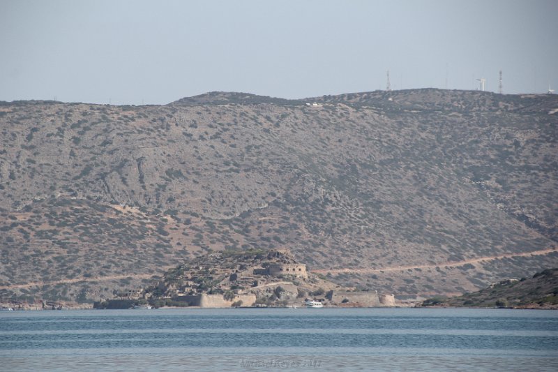 IMG_8376.JPG - Spinalonga is far off in the distance... We're headed here this day.  Ancient settlements were recorded nearby.   Later history included the Venetian Era.  Then around 1900 the island of Spinalonga became a Leper Colony till as late as 1957.  