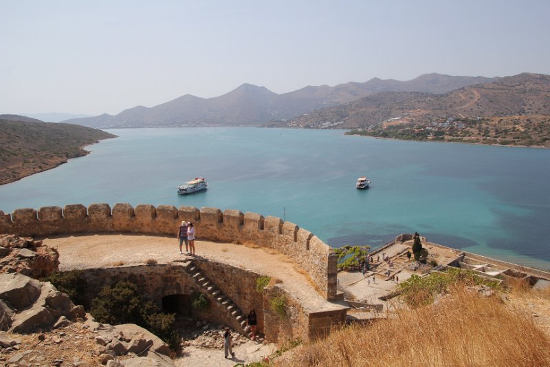 IMG_8500.JPG - Looking back from Spinalonga to Elounda(schisma)  accross the Harbor. Elounda's harbor, known as the Gulf of Korfos, is a natural, beautiful lagoon which is bordered by rugged peninsulas, and with the island of Spinalonga a good guard at the harbour entrance, it's like a shelter within a shelter with crystal, turquoise waters that is enclosed within the wider blue waters of the Gulf of Mirabello.